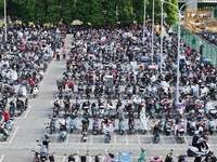 Electric bicycles are being seen at an electric vehicle parking lot near the Suzhou Rail Transit Line 11 Kunshan Huaqiao Station in Suzhou,...