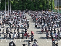 Electric bicycles are being seen at an electric vehicle parking lot near the Suzhou Rail Transit Line 11 Kunshan Huaqiao Station in Suzhou,...