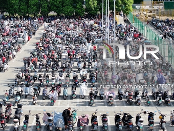 Electric bicycles are being seen at an electric vehicle parking lot near the Suzhou Rail Transit Line 11 Kunshan Huaqiao Station in Suzhou,...