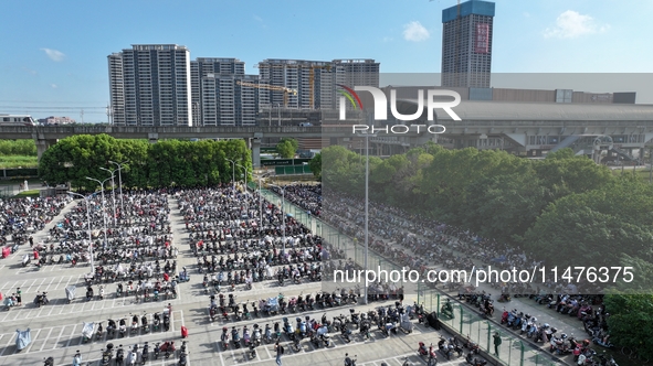 Electric bicycles are being seen at an electric vehicle parking lot near the Suzhou Rail Transit Line 11 Kunshan Huaqiao Station in Suzhou,...