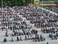 Electric bicycles are being seen at an electric vehicle parking lot near the Suzhou Rail Transit Line 11 Kunshan Huaqiao Station in Suzhou,...