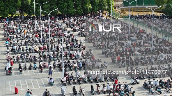 Electric bicycles are being seen at an electric vehicle parking lot near the Suzhou Rail Transit Line 11 Kunshan Huaqiao Station in Suzhou,...