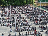 Electric bicycles are being seen at an electric vehicle parking lot near the Suzhou Rail Transit Line 11 Kunshan Huaqiao Station in Suzhou,...