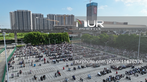 Electric bicycles are being seen at an electric vehicle parking lot near the Suzhou Rail Transit Line 11 Kunshan Huaqiao Station in Suzhou,...