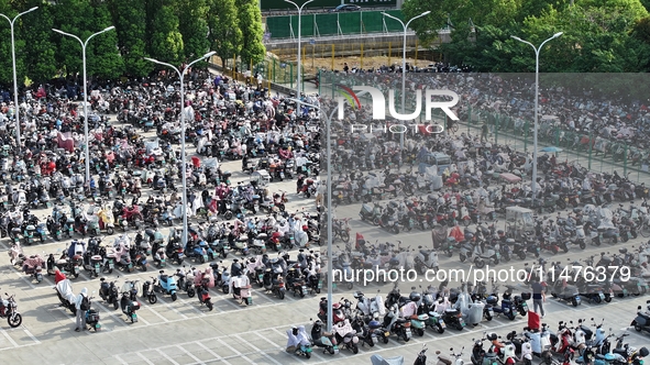 Electric bicycles are being seen at an electric vehicle parking lot near the Suzhou Rail Transit Line 11 Kunshan Huaqiao Station in Suzhou,...