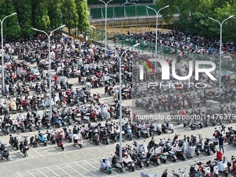 Electric bicycles are being seen at an electric vehicle parking lot near the Suzhou Rail Transit Line 11 Kunshan Huaqiao Station in Suzhou,...