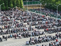 Electric bicycles are being seen at an electric vehicle parking lot near the Suzhou Rail Transit Line 11 Kunshan Huaqiao Station in Suzhou,...