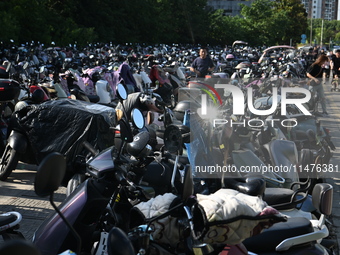 Electric bicycles are being seen at an electric vehicle parking lot near the Suzhou Rail Transit Line 11 Kunshan Huaqiao Station in Suzhou,...