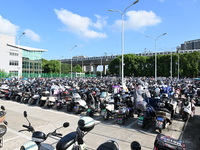 Electric bicycles are being seen at an electric vehicle parking lot near the Suzhou Rail Transit Line 11 Kunshan Huaqiao Station in Suzhou,...