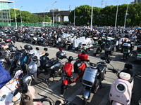 Electric bicycles are being seen at an electric vehicle parking lot near the Suzhou Rail Transit Line 11 Kunshan Huaqiao Station in Suzhou,...