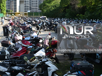 Electric bicycles are being seen at an electric vehicle parking lot near the Suzhou Rail Transit Line 11 Kunshan Huaqiao Station in Suzhou,...