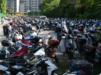 Electric bicycles are being seen at an electric vehicle parking lot near the Suzhou Rail Transit Line 11 Kunshan Huaqiao Station in Suzhou,...