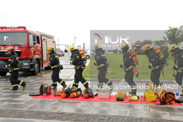 Fire personnel are conducting a firefighting drill at the scene of a high-rise building in Lianyungang, Jiangsu province, China, on August 1...