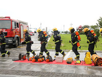 Fire personnel are conducting a firefighting drill at the scene of a high-rise building in Lianyungang, Jiangsu province, China, on August 1...