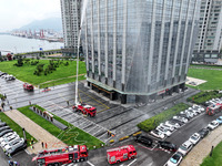 Fire personnel are conducting a firefighting drill at the scene of a high-rise building in Lianyungang, Jiangsu province, China, on August 1...