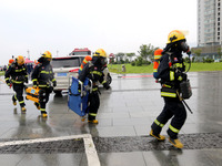 Fire personnel are conducting a firefighting drill at the scene of a high-rise building in Lianyungang, Jiangsu province, China, on August 1...