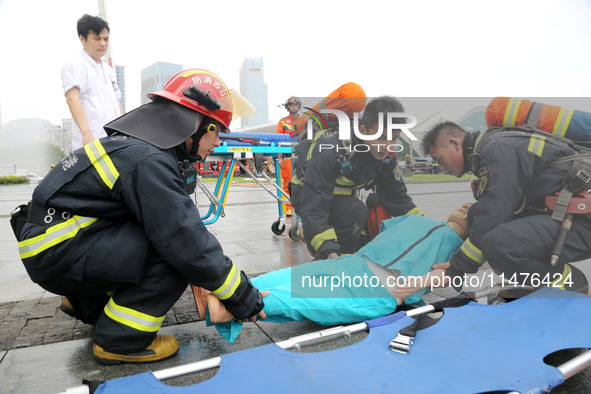 Fire personnel are conducting a firefighting drill at the scene of a high-rise building in Lianyungang, Jiangsu province, China, on August 1...