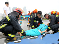 Fire personnel are conducting a firefighting drill at the scene of a high-rise building in Lianyungang, Jiangsu province, China, on August 1...