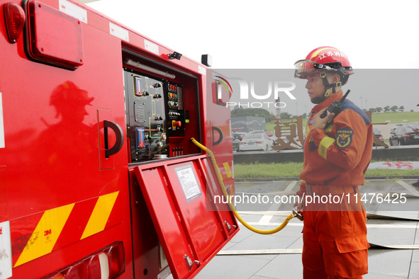 Fire personnel are conducting a firefighting drill at the scene of a high-rise building in Lianyungang, Jiangsu province, China, on August 1...