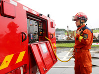 Fire personnel are conducting a firefighting drill at the scene of a high-rise building in Lianyungang, Jiangsu province, China, on August 1...