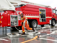 Fire personnel are conducting a firefighting drill at the scene of a high-rise building in Lianyungang, Jiangsu province, China, on August 1...