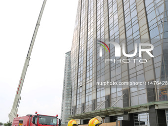 Fire personnel are conducting a firefighting drill at the scene of a high-rise building in Lianyungang, Jiangsu province, China, on August 1...