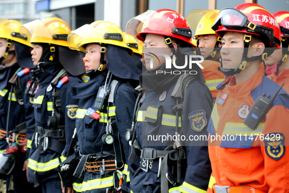 Fire personnel are conducting a firefighting drill at the scene of a high-rise building in Lianyungang, Jiangsu province, China, on August 1...