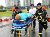 Fire personnel are conducting a firefighting drill at the scene of a high-rise building in Lianyungang, Jiangsu province, China, on August 1...