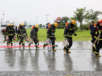 Fire personnel are conducting a firefighting drill at the scene of a high-rise building in Lianyungang, Jiangsu province, China, on August 1...