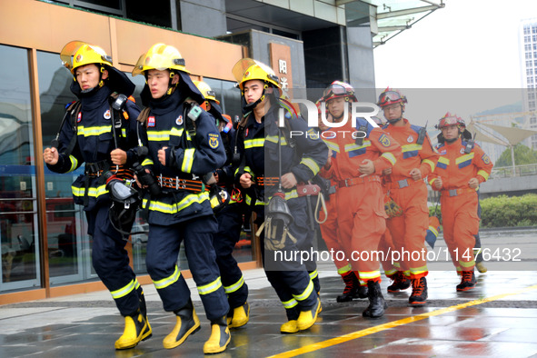 Fire personnel are conducting a firefighting drill at the scene of a high-rise building in Lianyungang, Jiangsu province, China, on August 1...