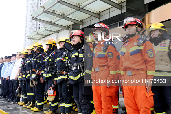 Fire personnel are conducting a firefighting drill at the scene of a high-rise building in Lianyungang, Jiangsu province, China, on August 1...