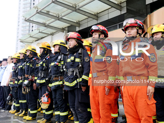 Fire personnel are conducting a firefighting drill at the scene of a high-rise building in Lianyungang, Jiangsu province, China, on August 1...