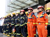 Fire personnel are conducting a firefighting drill at the scene of a high-rise building in Lianyungang, Jiangsu province, China, on August 1...