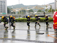 Fire personnel are conducting a firefighting drill at the scene of a high-rise building in Lianyungang, Jiangsu province, China, on August 1...