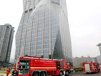 Fire personnel are conducting a firefighting drill at the scene of a high-rise building in Lianyungang, Jiangsu province, China, on August 1...