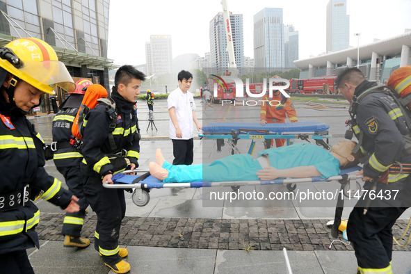 Fire personnel are conducting a firefighting drill at the scene of a high-rise building in Lianyungang, Jiangsu province, China, on August 1...