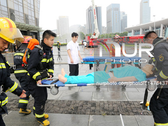 Fire personnel are conducting a firefighting drill at the scene of a high-rise building in Lianyungang, Jiangsu province, China, on August 1...