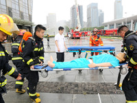 Fire personnel are conducting a firefighting drill at the scene of a high-rise building in Lianyungang, Jiangsu province, China, on August 1...