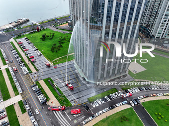 Fire personnel are conducting a firefighting drill at the scene of a high-rise building in Lianyungang, Jiangsu province, China, on August 1...