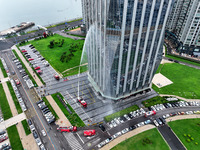 Fire personnel are conducting a firefighting drill at the scene of a high-rise building in Lianyungang, Jiangsu province, China, on August 1...