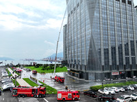 Fire personnel are conducting a firefighting drill at the scene of a high-rise building in Lianyungang, Jiangsu province, China, on August 1...