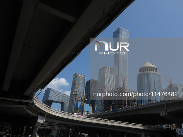 Pedestrians are riding on the streets of the CBD in Beijing, China, on August 14, 2024. 