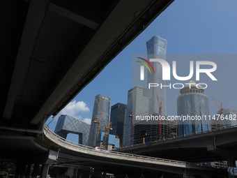 Pedestrians are riding on the streets of the CBD in Beijing, China, on August 14, 2024. (