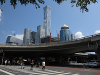 Pedestrians are riding on the streets of the CBD in Beijing, China, on August 14, 2024. (