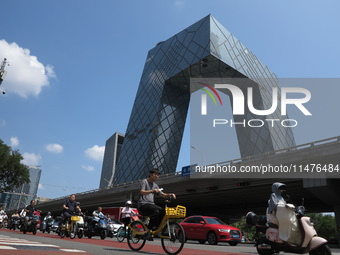 Pedestrians are riding on the streets of the CBD in Beijing, China, on August 14, 2024. (