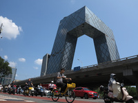 Pedestrians are riding on the streets of the CBD in Beijing, China, on August 14, 2024. (