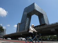 Pedestrians are riding on the streets of the CBD in Beijing, China, on August 14, 2024. (