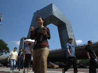 Pedestrians are riding on the streets of the CBD in Beijing, China, on August 14, 2024. (