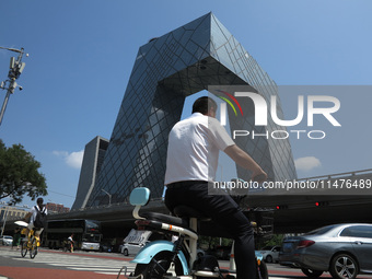 Pedestrians are riding on the streets of the CBD in Beijing, China, on August 14, 2024. (