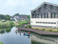 River cleaners are performing daily cleaning at Miaoqiantou River in Dongheng Village, Huzhou City, East China's Zhejiang Province, on Augus...